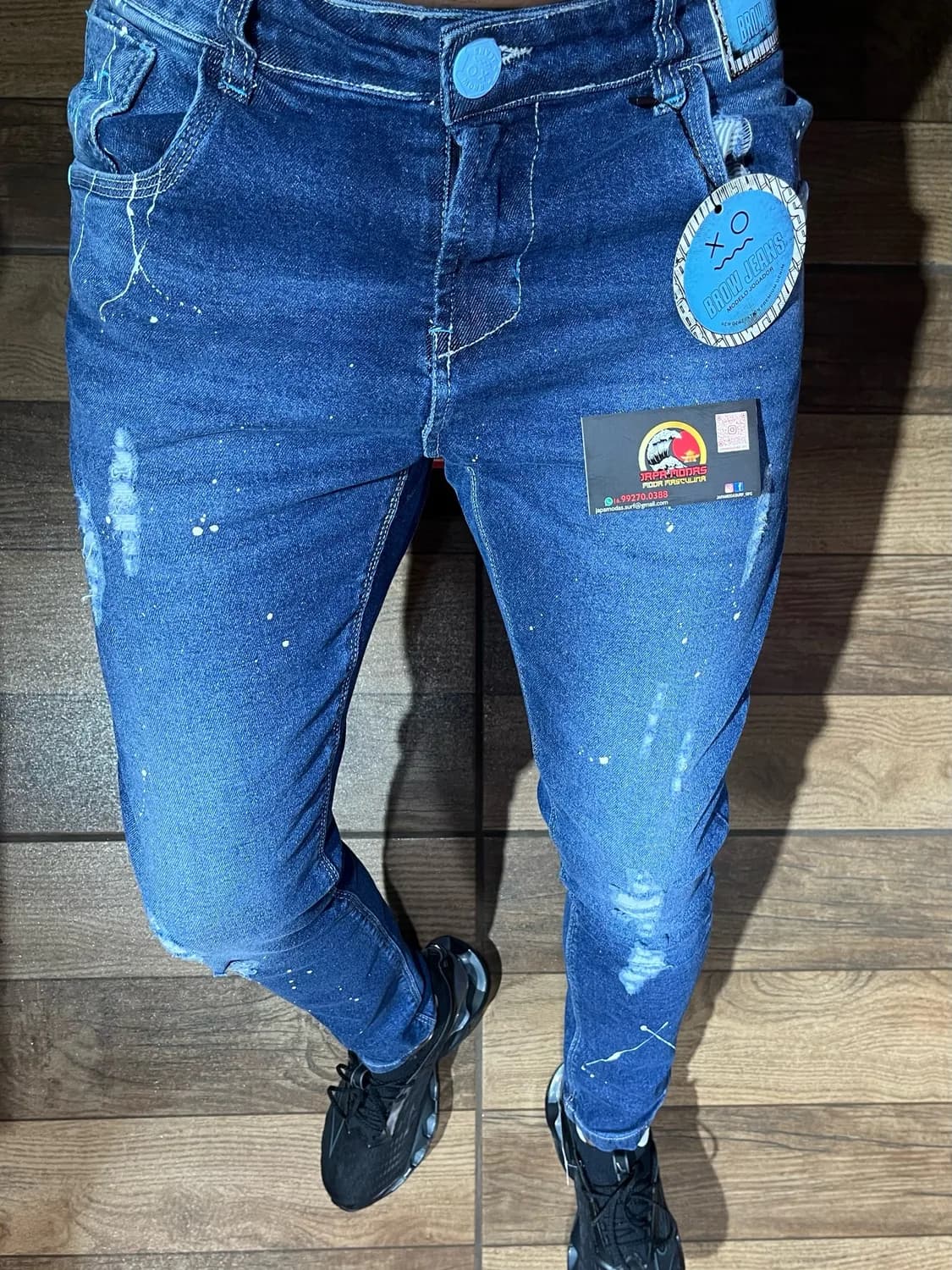 Calça jeans jogador azul com respingos